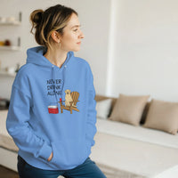 Load image into Gallery viewer, Carolina Blue - Never Drink Alone hoodie, worn by a woman sitting on a couch in a living room
