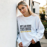 Load image into Gallery viewer, White - My Lab Runs This House sweatshirt, worn by a woman leaning on a white wall
