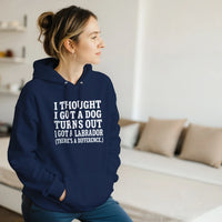 Load image into Gallery viewer, Navy - I Thought I Got a Dog hoodie, worn by a woman seated in a bright living room
