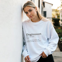 Load image into Gallery viewer, White - Dogtrovert sweatshirt, worn by a woman leaning on a white wall
