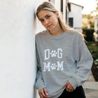 Load image into Gallery viewer, Ash - Dog Mom sweatshirt, worn by a woman leaning on a white wall
