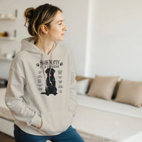 Load image into Gallery viewer, Sand - Anatomy of a Black Lab hoodie, worn by a woman in a bright living room
