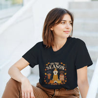 Load image into Gallery viewer, Black - Tis the Season fall Labs tee, worn by a smiling woman, seated outdoors
