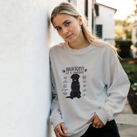 Load image into Gallery viewer, White - Anatomy of a Black Lab sweatshirt, worn by a woman leaning on a white wall
