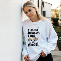 Load image into Gallery viewer, White - I Just Really Like Dogs sweatshirt, worn by a woman leaning on a white wall
