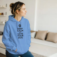 Load image into Gallery viewer, Carolina Blue - Keep Calm and Love Your Dog hoodie, worn by a woman sitting on a couch in a living room
