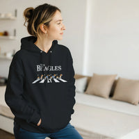 Load image into Gallery viewer, Black - The Beagles hoodie, worn by a woman sitting on a couch in a living room

