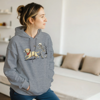 Load image into Gallery viewer, Graphite Heather - Dog Stealing Bone Halloween hoodie, worn by a woman sitting on a couch in a living room
