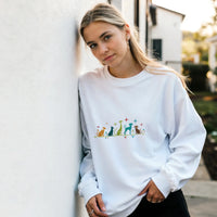 Load image into Gallery viewer, White - Mid-Century Modern Dogs sweatshirt, worn by a woman leaning on a white wall
