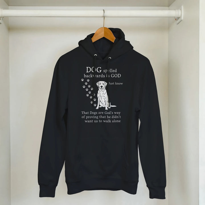 Black - Dog Spelled Backwards Is God hoodie, hanging in a closet