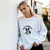 Load image into Gallery viewer, White - Just Throw It Border Collie sweatshirt, worn by a woman leaning on a white wall
