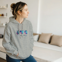 Load image into Gallery viewer, Ash - Peace Love Dogs hoodie, worn by woman in bright living room
