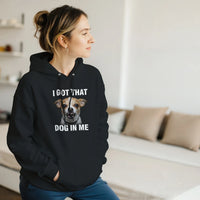 Load image into Gallery viewer, Black - I Got That Dog In Me hoodie, worn by a woman sitting on a couch in a living room
